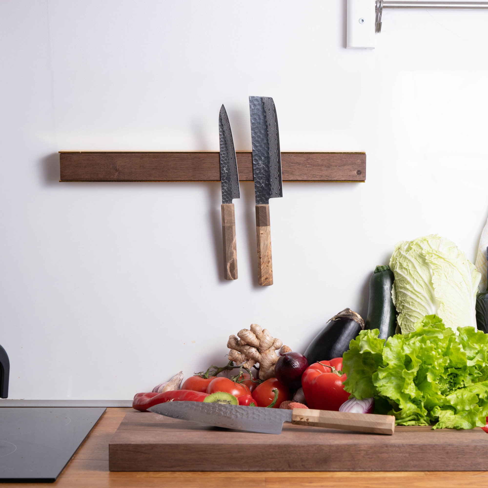 brass wooden on wall mounted magnetic kitchen knife rack with sakai kyuba knives