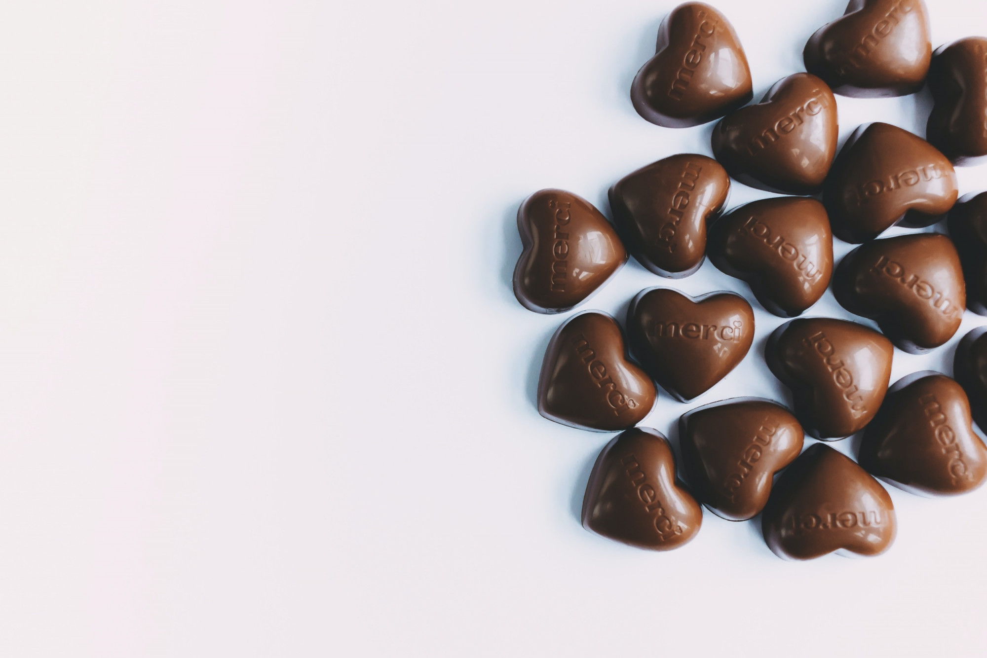 Chocolate hearts on white background