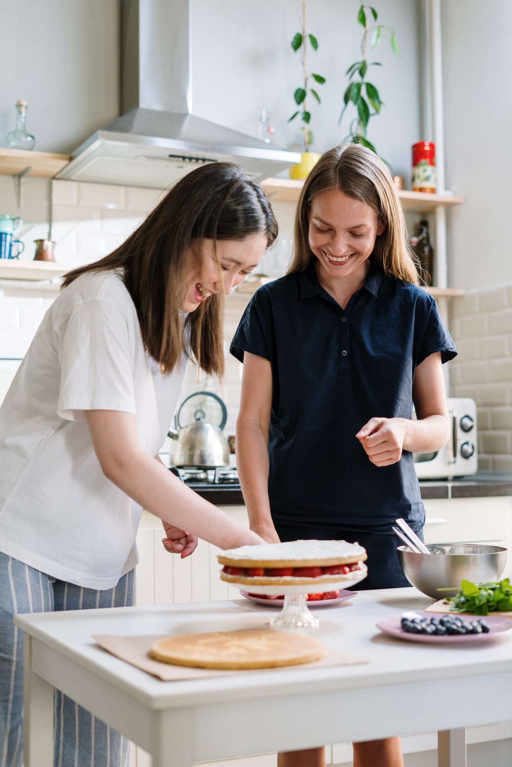 Two women baking a cake