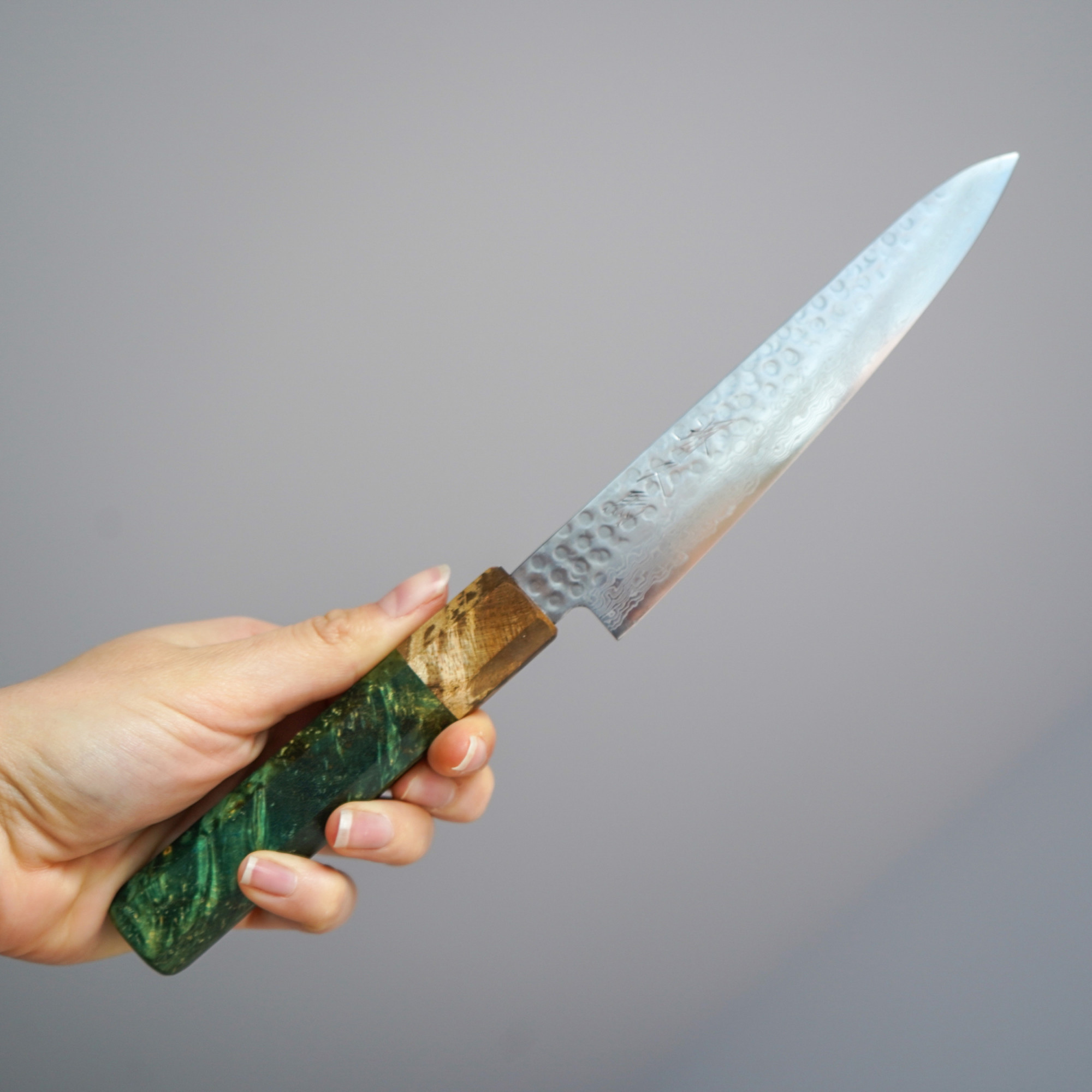 Sakai Kyuba – Paring Knife 15cm – The Petty with Olive Green handle held by hand