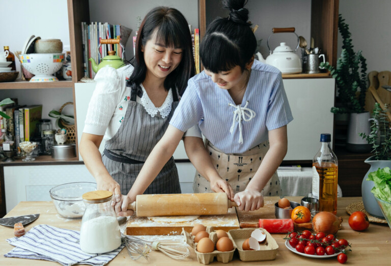 Mother and daughter cooking together