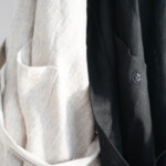 Kitchen Apron - Natural and Off Black, hanging logo Kitchen Apron - Natural and Off Black, hanging logo