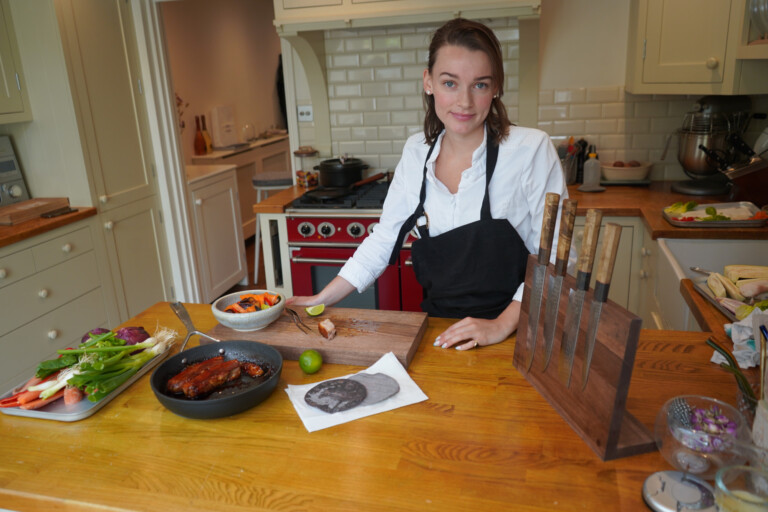 Chef olivia burt with sakai kyuba knife set in brown and knife stand
