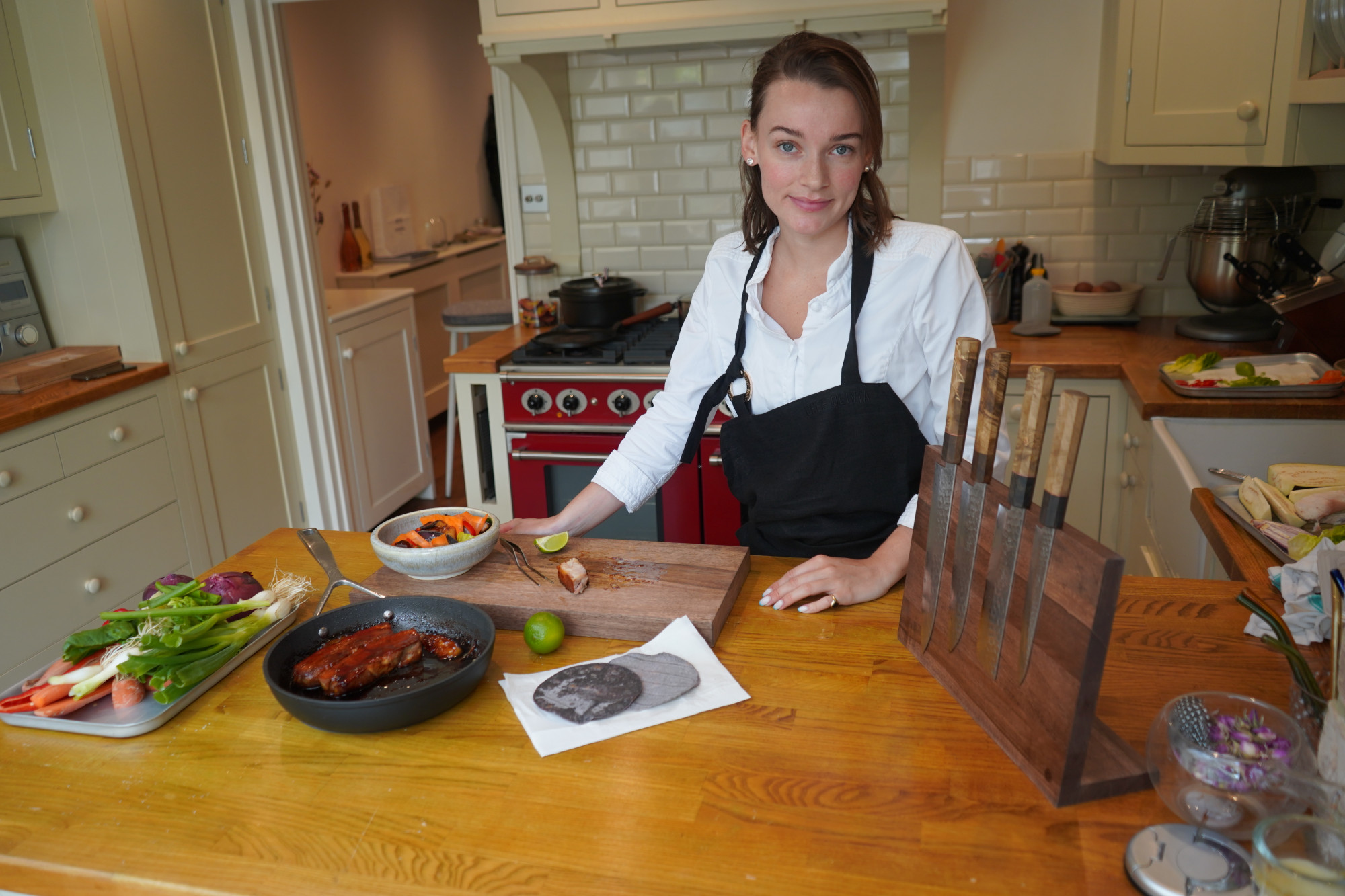 Chef olivia burt with sakai kyuba knife set in brown and knife stand