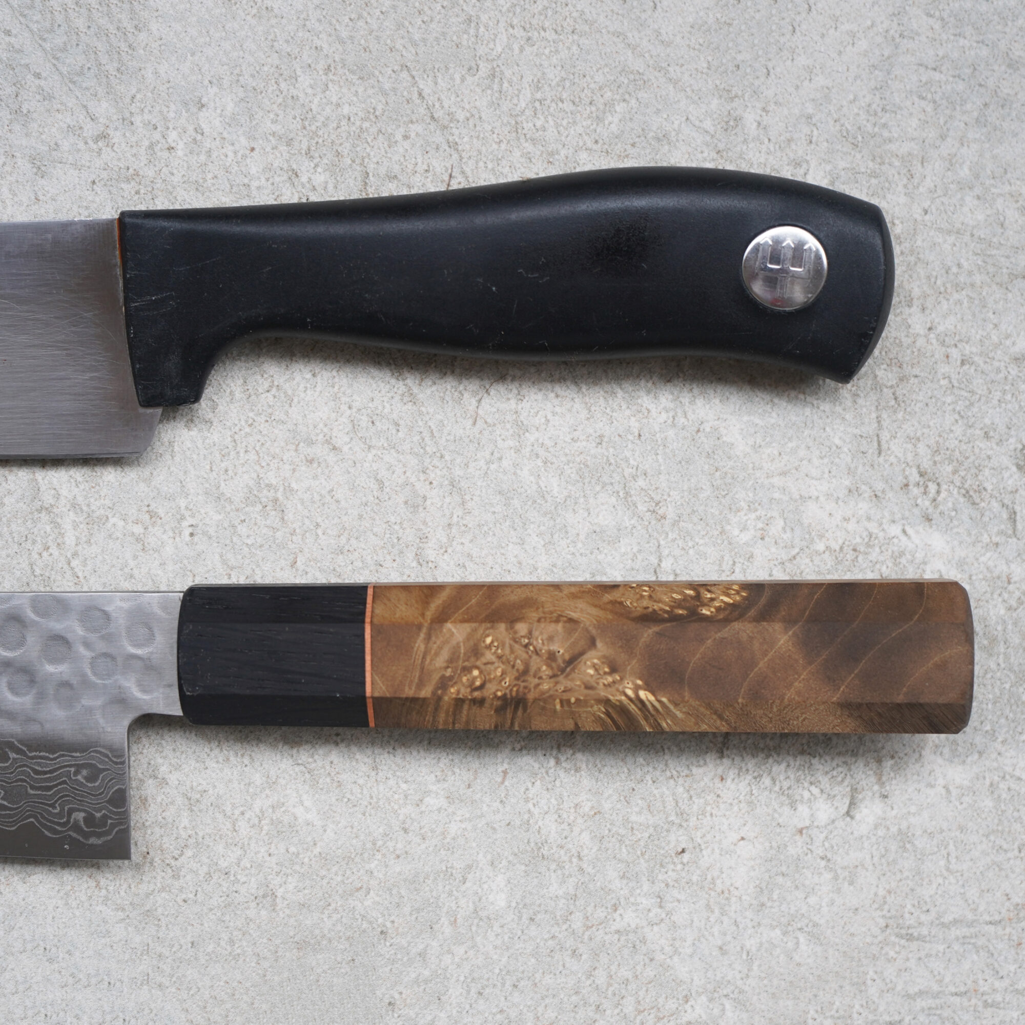 The wooden handle — maple burl and bog oak separated by a copper ring — that an occasional oiling keeps sealed